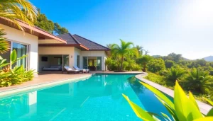 Property management Phuket services in a luxury villa with pool, showcasing tropical surroundings and bright sunlight.