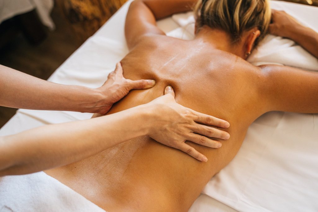 a-person-massaging-a-clients-bare-back-1024x683